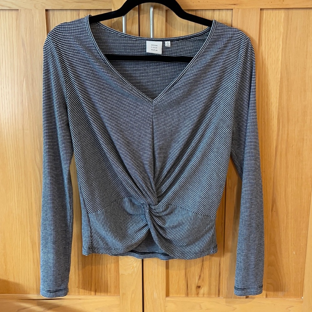 Good luck gem, size small, black striped shirt!